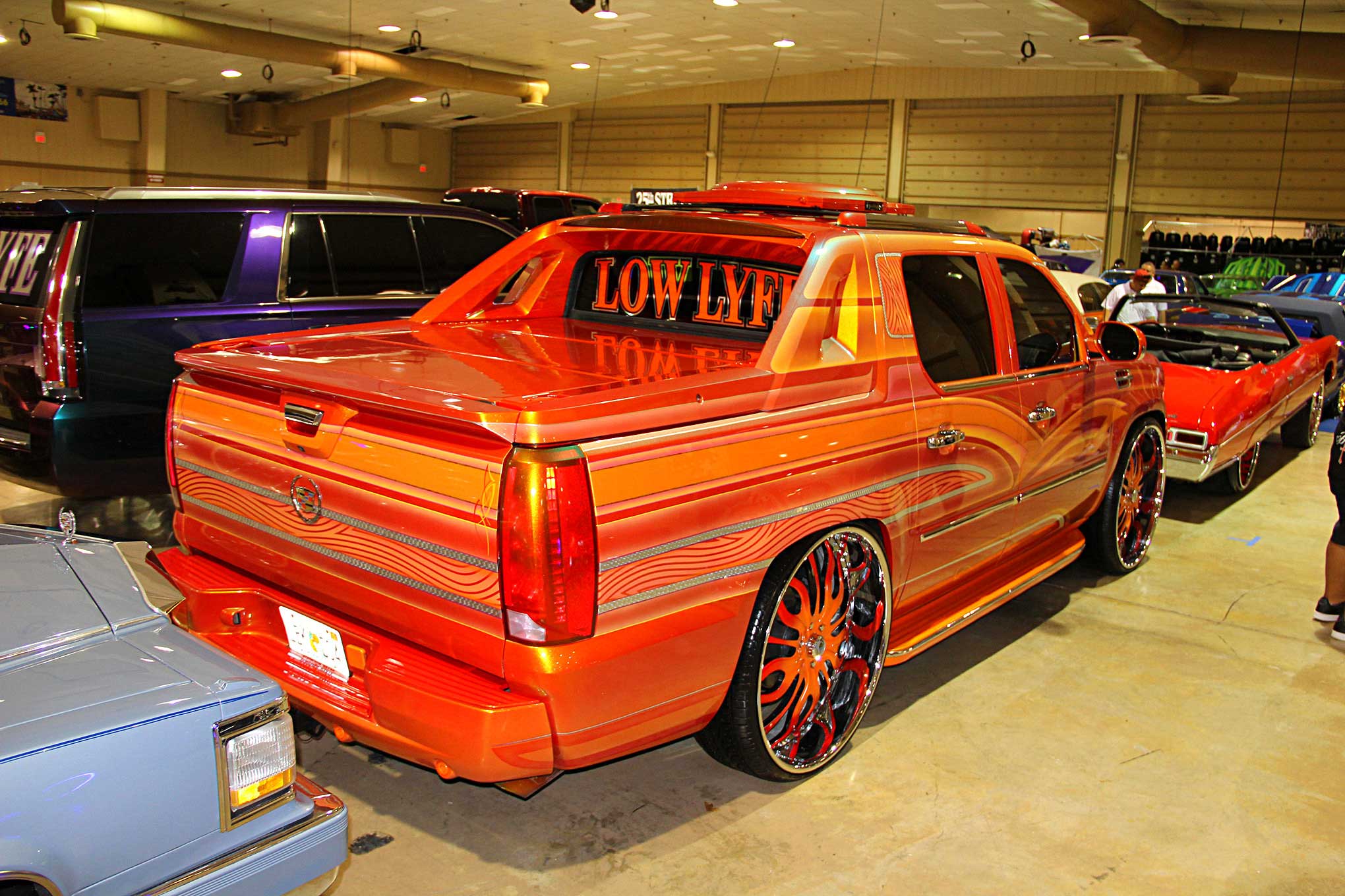 https://st.lowrider.com/uploads/sites/7/2019/05/2019-Lowrider-Miami-Super-Show-Low-Lyfe-CC-Cadillac-Escalade.jpg